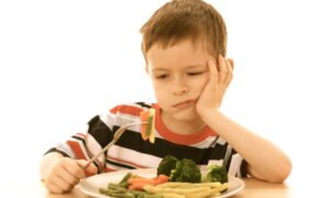 5-6 years old boy and plate