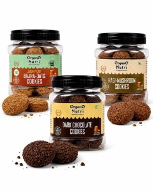 Three OrganO Nutri cookie jars in flavors Bajra-Oats, Dark Chocolate, and Ragi-Mushroom with cookies scattered around them on a white background.