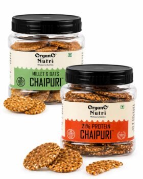 Two clear jars of Organo Nutri Chaipuri crackers millet  oats and 21 protein with green and orange labels on a white background several crackers scattered nearby